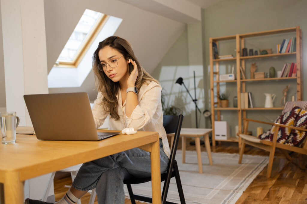 Beautiful young woman working from her home office