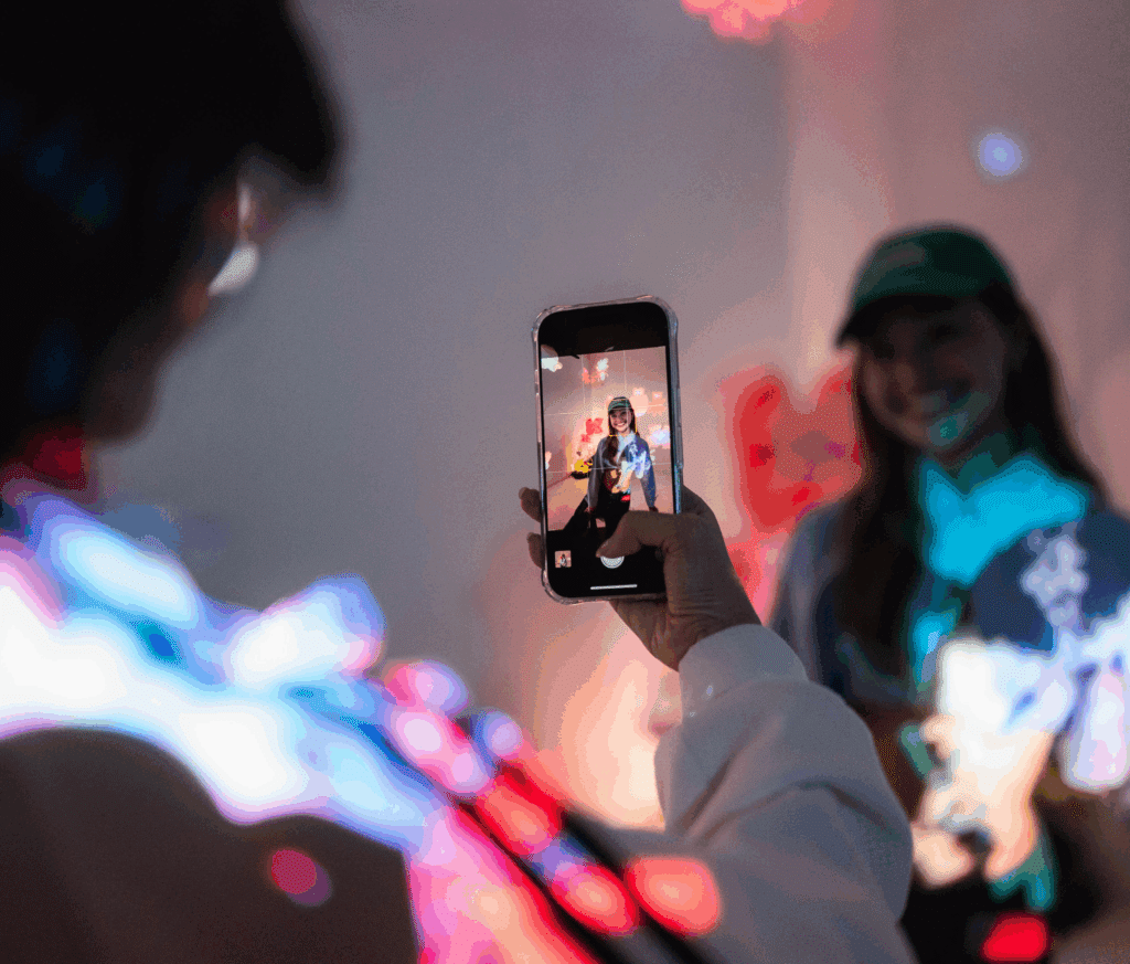 Creative marketing, a lady takes a photo of a co worker